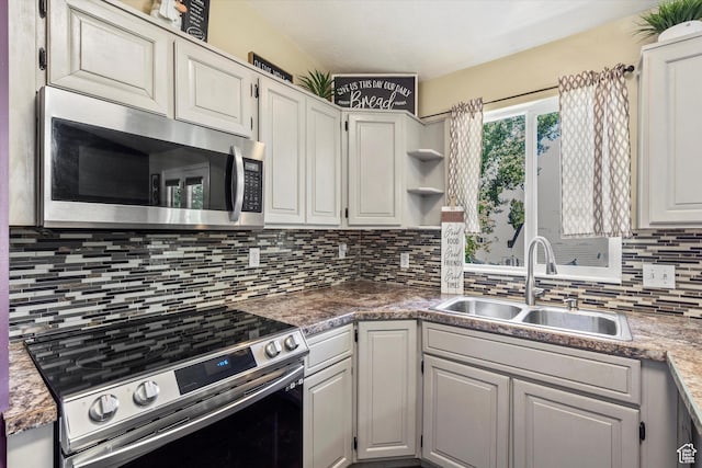 3916 W 4800 S, Roy, UT 84067 - kitchen featuring stainless steel appliances, a sink, decorative backsplash, open shelves, and white cabinetry
