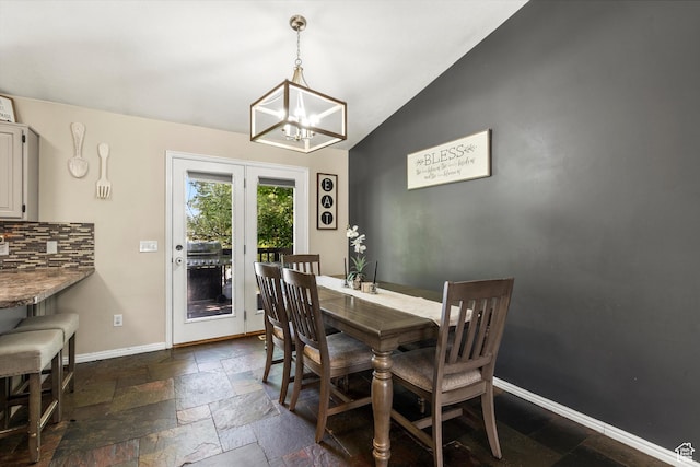 3916 W 4800 S, Roy, UT 84067 - dining room featuring a chandelier, stone tile floors, baseboards, and lofted ceiling