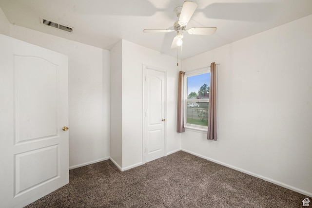 611 E 500 N, Spanish Fork, UT 84660 - unfurnished room with dark colored carpet, baseboards, and a ceiling fan
