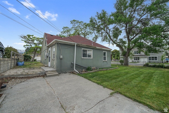 611 E 500 N, Spanish Fork, UT 84660 - rear view of house with a patio, a shingled roof, and stucco siding