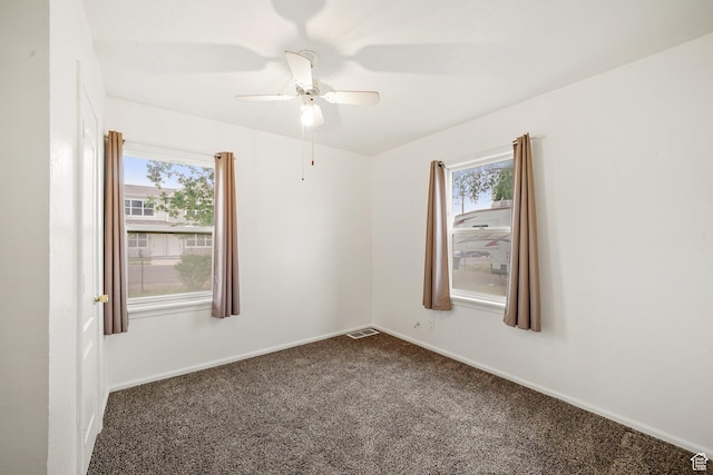 611 E 500 N, Spanish Fork, UT 84660 - empty room featuring plenty of natural light, dark carpet, a ceiling fan, and baseboards