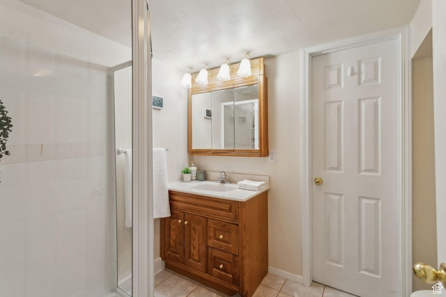 295 S 2nd St, Tooele, UT 84074 - full bath with vanity, a stall shower, tile patterned floors, and baseboards