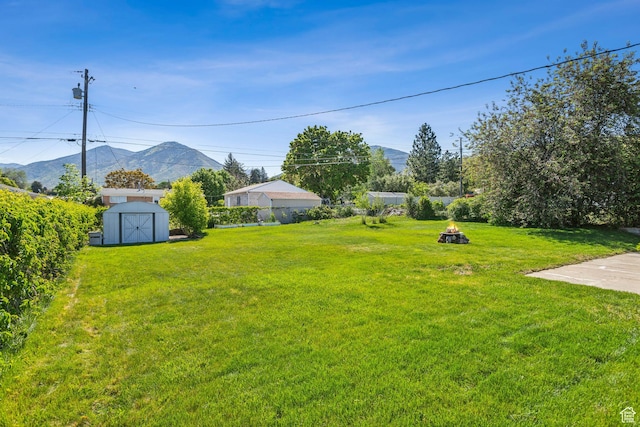 295 S 2nd St, Tooele, UT 84074 - view of yard with a mountain view and a fire pit