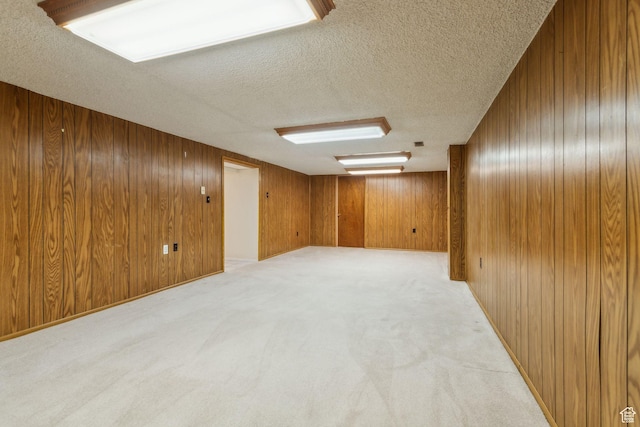 295 S 2nd St, Tooele, UT 84074 - empty room with wood walls, a textured ceiling, and light carpet