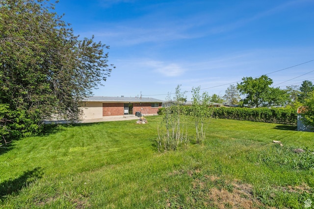 295 S 2nd St, Tooele, UT 84074 - view of green lawn featuring a patio area