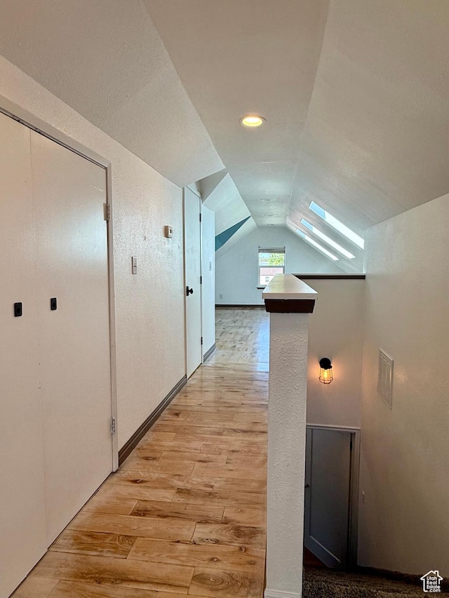 169 N State St, Roosevelt, UT 84066 - hallway with light wood-style flooring and lofted ceiling