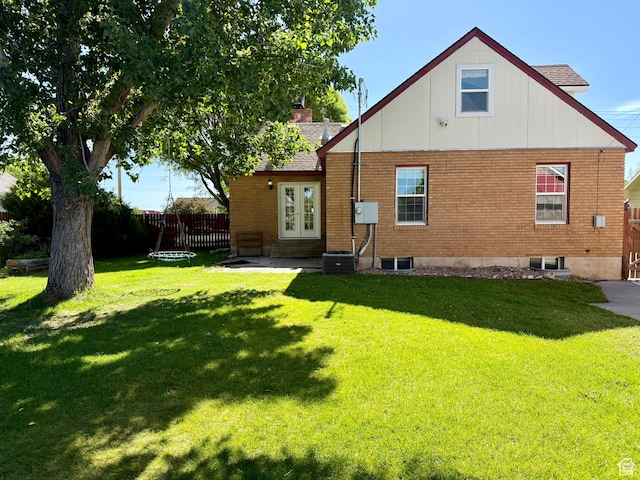 169 N State St, Roosevelt, UT 84066 - rear view of house with brick siding, entry steps, french doors, and roof with shingles