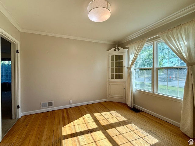 169 N State St, Roosevelt, UT 84066 - unfurnished room featuring baseboards, hardwood / wood-style floors, and crown molding