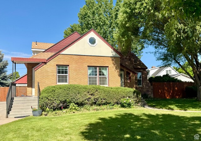 169 N State St, Roosevelt, UT 84066 - view of side of home featuring a shingled roof