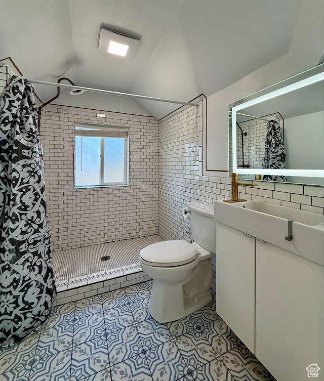 169 N State St, Roosevelt, UT 84066 - bathroom with toilet, tile patterned floors, tiled shower, tile walls, and vanity