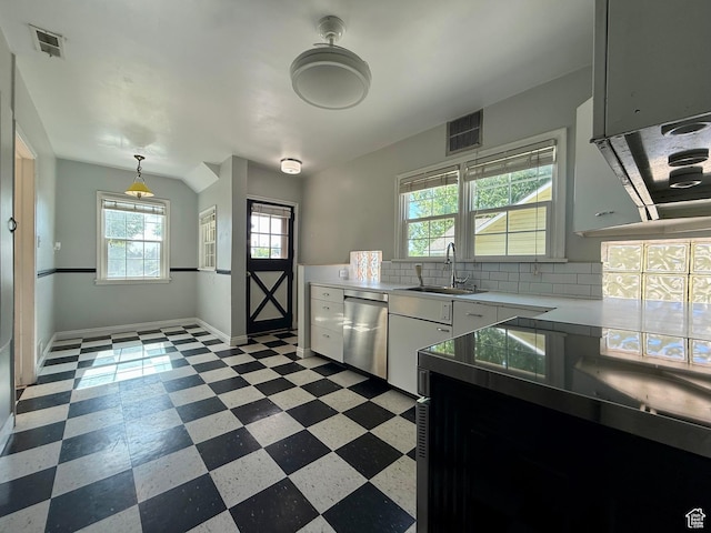 169 N State St, Roosevelt, UT 84066 - kitchen with stainless steel dishwasher, a sink, light floors, light countertops, and tasteful backsplash