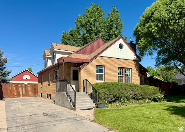 169 N State St, Roosevelt, UT 84066 - view of front facade featuring a chimney and roof with shingles