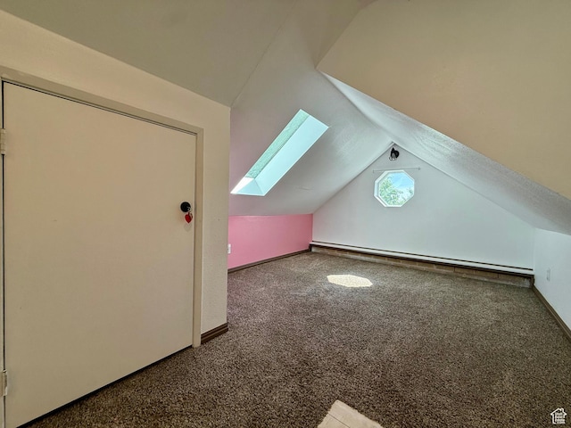 169 N State St, Roosevelt, UT 84066 - bonus room with a skylight, carpet flooring, vaulted ceiling, a baseboard radiator, and baseboards