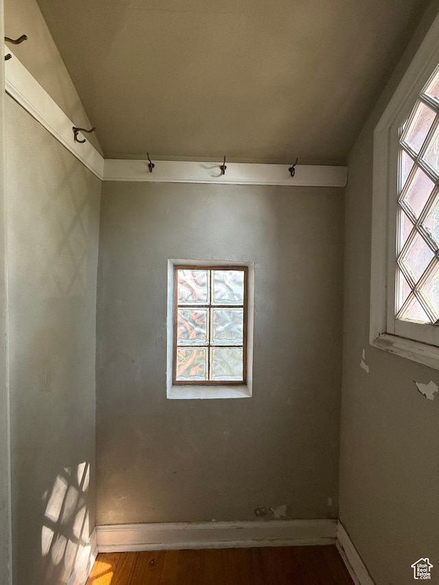 169 N State St, Roosevelt, UT 84066 - empty room featuring wood finished floors, baseboards, and lofted ceiling
