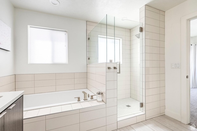 260 W 500 N Unit 4, Salt Lake City, UT 84103 - full bathroom with a stall shower, a bath, and vanity