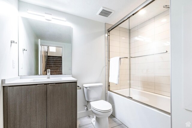 260 W 500 N Unit 4, Salt Lake City, UT 84103 - bathroom featuring toilet, vanity, shower / bath combination with glass door, and baseboards