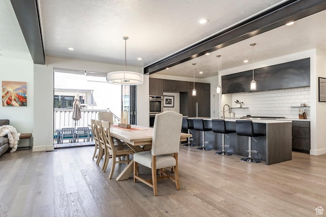 260 W 500 N Unit 4, Salt Lake City, UT 84103 - dining area with light wood-style floors, recessed lighting, and baseboards