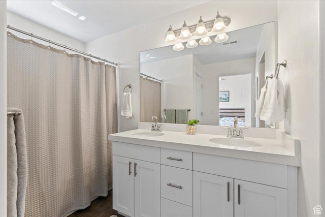 3624 N Annabell St, Eagle Mountain, UT 84005 - ensuite bathroom featuring double vanity, wood finished floors, and a shower with curtain