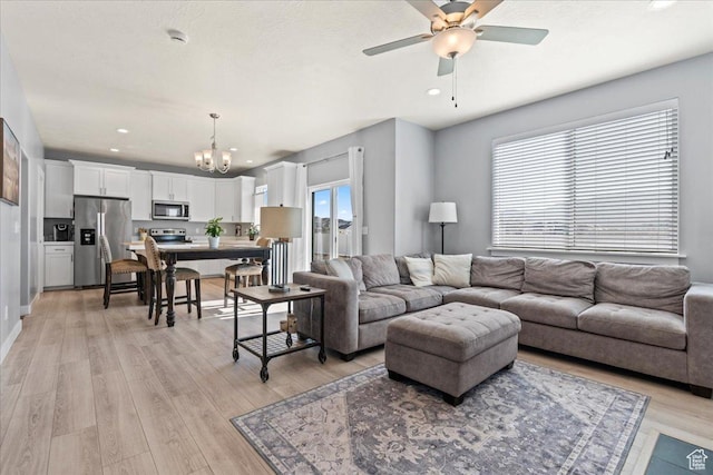 3624 N Annabell St, Eagle Mountain, UT 84005 - living area with a chandelier, ceiling fan, light wood finished floors, and recessed lighting