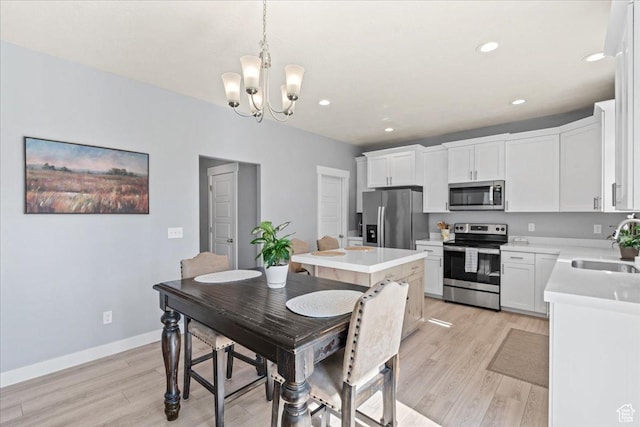 3624 N Annabell St, Eagle Mountain, UT 84005 - dining area with a chandelier, light wood-style flooring, recessed lighting, and baseboards