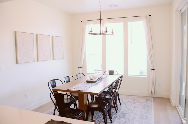 1376 Rustico, Washington, UT 84780 - dining room with a chandelier, light wood finished floors, and baseboards