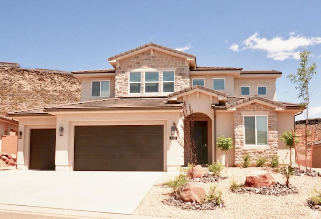 1376 Rustico, Washington, UT 84780 - view of front of house featuring stone siding, a tile roof, stucco siding, concrete driveway, and an attached garage