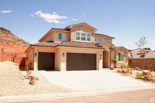 1376 Rustico, Washington, UT 84780 - mediterranean / spanish home with a tiled roof, stucco siding, an attached garage, and driveway