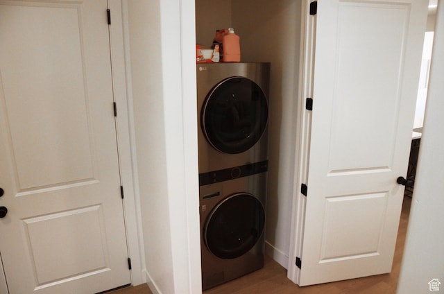 1376 Rustico, Washington, UT 84780 - laundry area with stacked washer / drying machine, light wood-style flooring, and baseboards