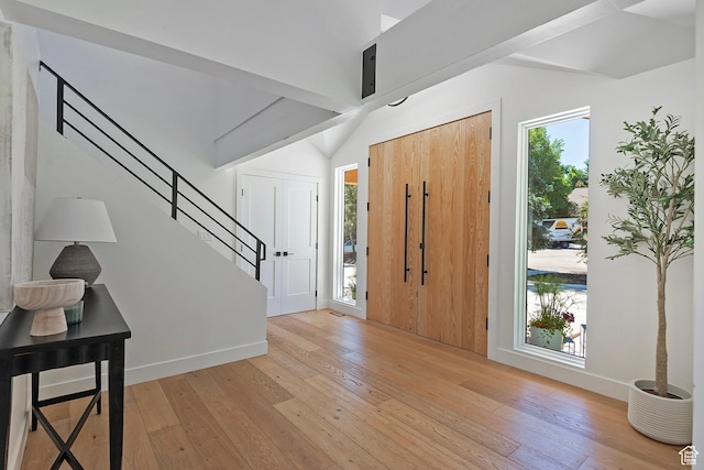 1504 Lake Front Ct, Park City, UT 84098 - entryway with lofted ceiling, light wood finished floors, stairs, and baseboards