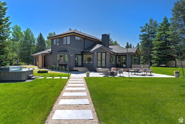 1504 Lake Front Ct, Park City, UT 84098 - back of property featuring a chimney, a patio area, and a lawn