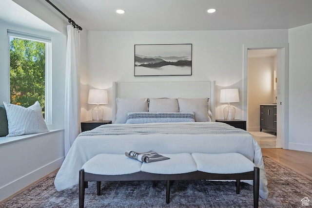 1504 Lake Front Ct, Park City, UT 84098 - bedroom with wood finished floors, baseboards, recessed lighting, and connected bathroom