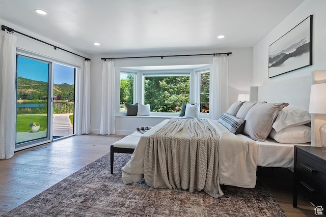 1504 Lake Front Ct, Park City, UT 84098 - bedroom with access to exterior, multiple windows, wood finished floors, and recessed lighting