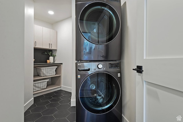 1504 Lake Front Ct, Park City, UT 84098 - laundry room with stacked washer / drying machine, baseboards, dark tile patterned floors, and recessed lighting
