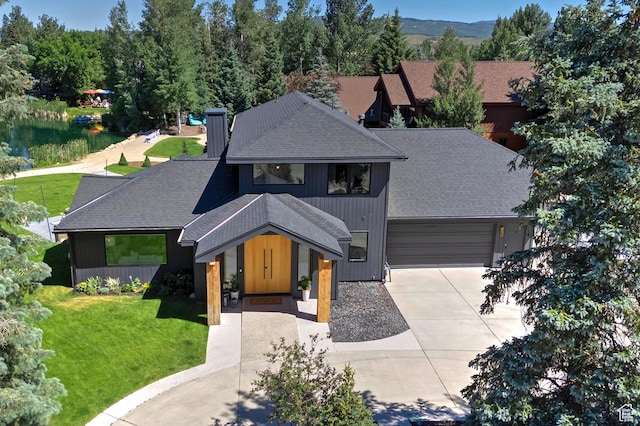 1504 Lake Front Ct, Park City, UT 84098 - view of front of property featuring a shingled roof, driveway, a front lawn, a chimney, and an attached garage