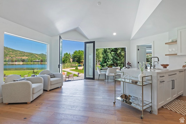 1504 Lake Front Ct, Park City, UT 84098 - kitchen with vaulted ceiling, a sink, open shelves, white cabinetry, and light countertops