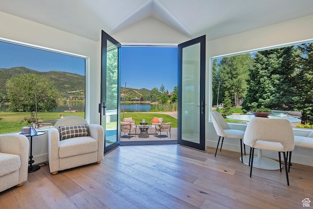 1504 Lake Front Ct, Park City, UT 84098 - living area with hardwood / wood-style floors, plenty of natural light, a water view, and vaulted ceiling