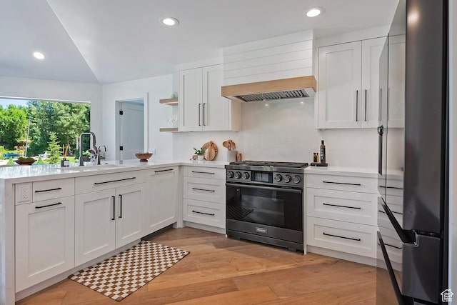 1504 Lake Front Ct, Park City, UT 84098 - kitchen featuring stainless steel appliances, a sink, custom exhaust hood, light countertops, and white cabinetry