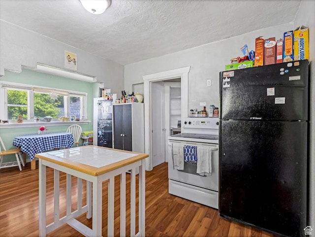 628 E 420 N, Provo, UT 84606 - kitchen with freestanding refrigerator, white electric range oven, wood finished floors, and a textured ceiling