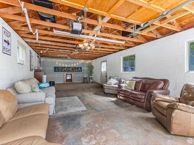 628 E 420 N, Provo, UT 84606 - living area featuring unfinished concrete flooring and concrete block wall