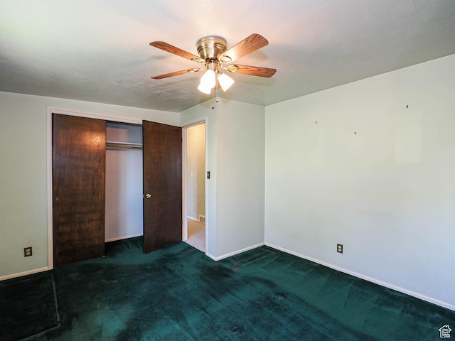 5747 S Sanford Dr, Murray, UT 84123 - unfurnished bedroom with dark colored carpet, baseboards, a closet, and a ceiling fan