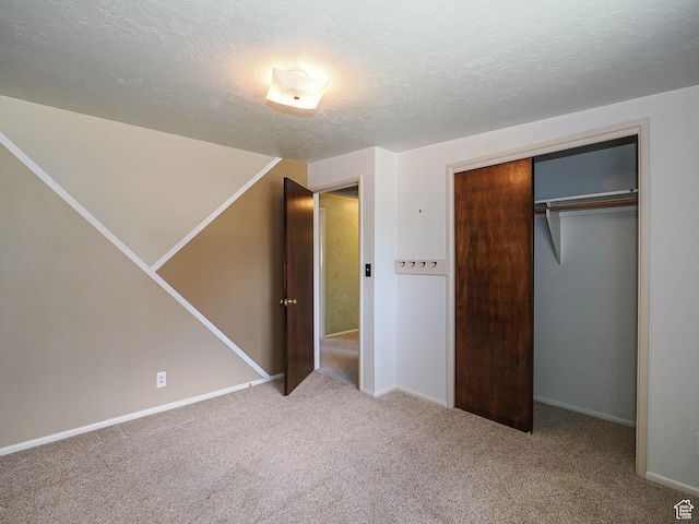 5747 S Sanford Dr, Murray, UT 84123 - unfurnished bedroom featuring carpet, a textured ceiling, baseboards, and a closet
