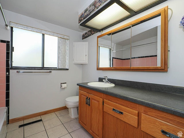 5747 S Sanford Dr, Murray, UT 84123 - bathroom featuring healthy amount of natural light, vanity, toilet, and tile patterned flooring