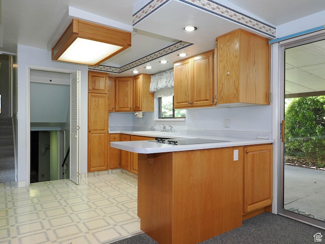 5747 S Sanford Dr, Murray, UT 84123 - kitchen with a peninsula, light countertops, light flooring, a kitchen breakfast bar, and recessed lighting