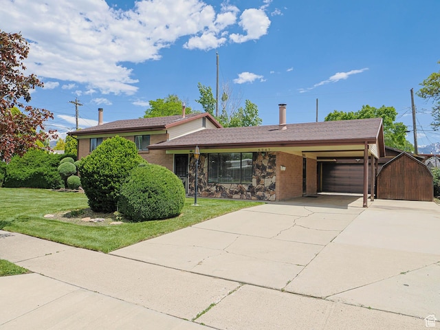5747 S Sanford Dr, Murray, UT 84123 - tri-level home featuring concrete driveway, a front lawn, an attached garage, and brick siding