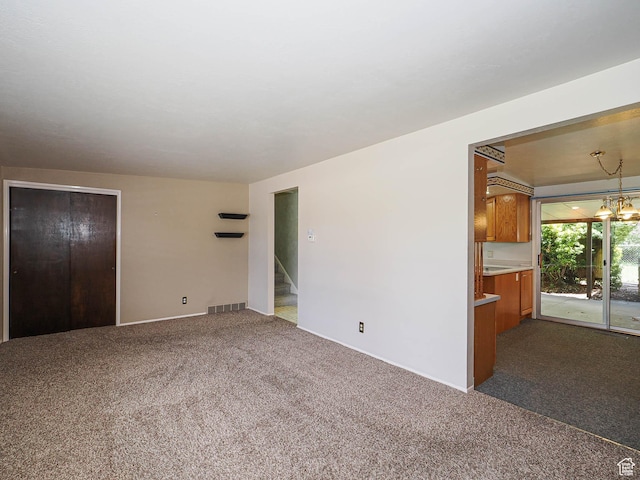 5747 S Sanford Dr, Murray, UT 84123 - unfurnished living room with dark carpet, baseboards, and stairs