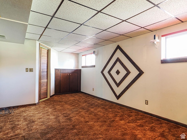 5747 S Sanford Dr, Murray, UT 84123 - below grade area featuring dark carpet, a drop ceiling, and baseboards