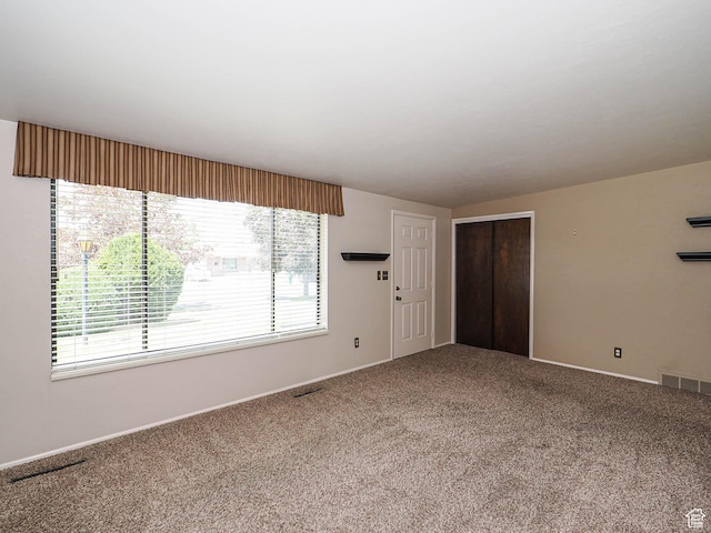 5747 S Sanford Dr, Murray, UT 84123 - unfurnished living room with carpet floors and baseboards