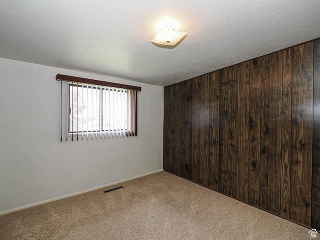 5747 S Sanford Dr, Murray, UT 84123 - carpeted empty room with wood walls and baseboards