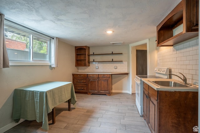 354 N 200 E, Logan, UT 84321 - kitchen featuring open shelves, white electric stove, a sink, and backsplash