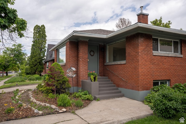 354 N 200 E, Logan, UT 84321 - view of front of house with brick siding and a chimney